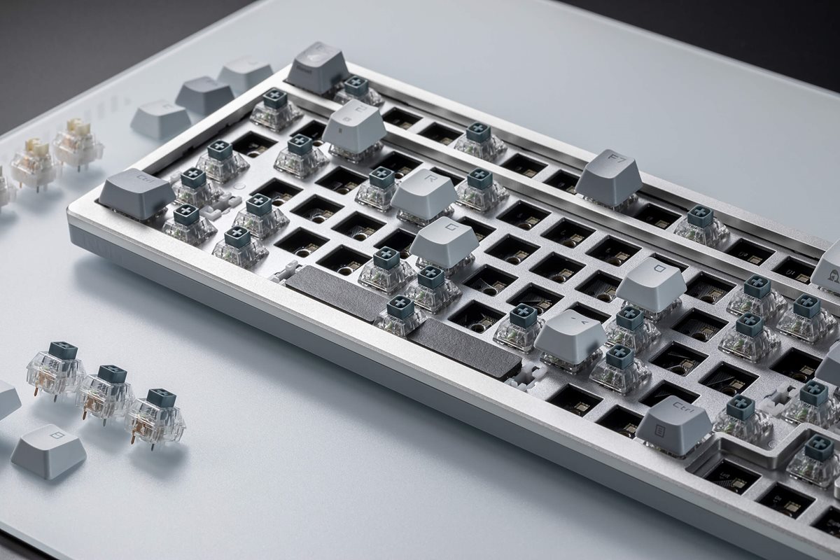 A close up view of ROG Azoth Moonlight White with most key switches removed.