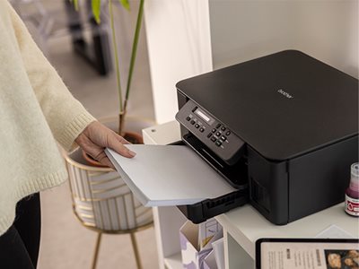 Brother DCP-T580DW front loading paper tray used in a home environment