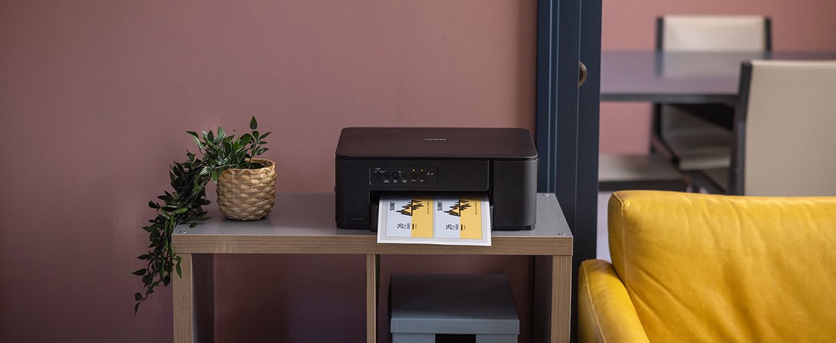 Brother DCP-J1260DW on a shelving unit in a home environment