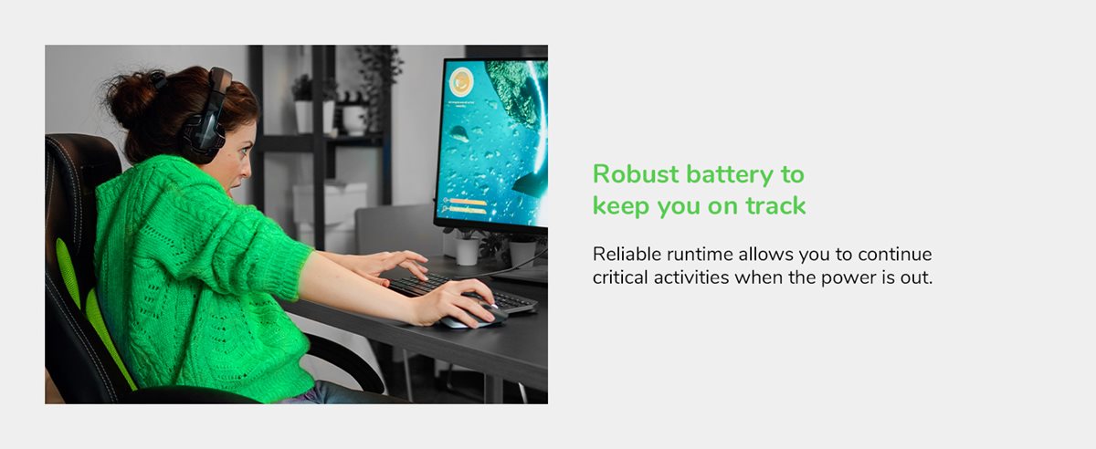 Woman playing a game on her desktop computer.