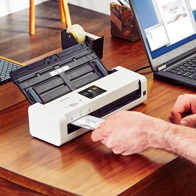 Scanner on desk, scanning a business card