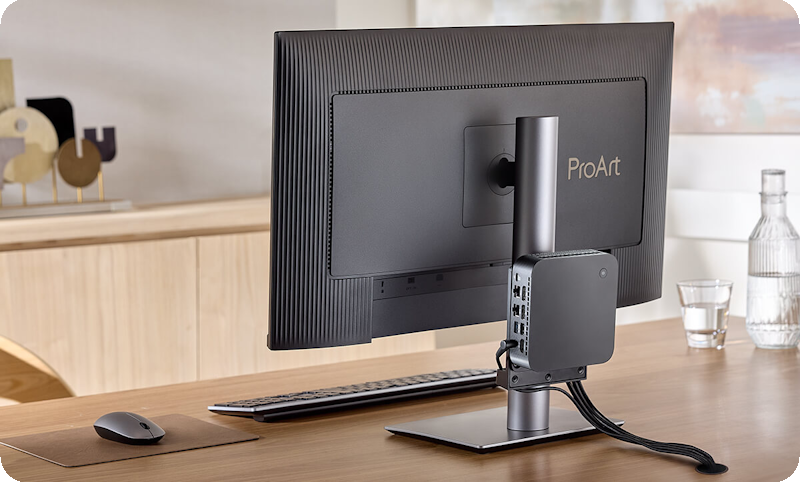 A monitor mounted a NUC/mini PC on the column to shows space-saving.