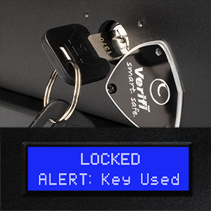 Key inserted into hidden keyway behind the logo plate of a Verifi Smart Safe S6000