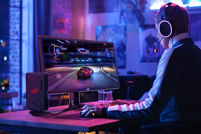 A gamer wearing headphones and playing an HDR game